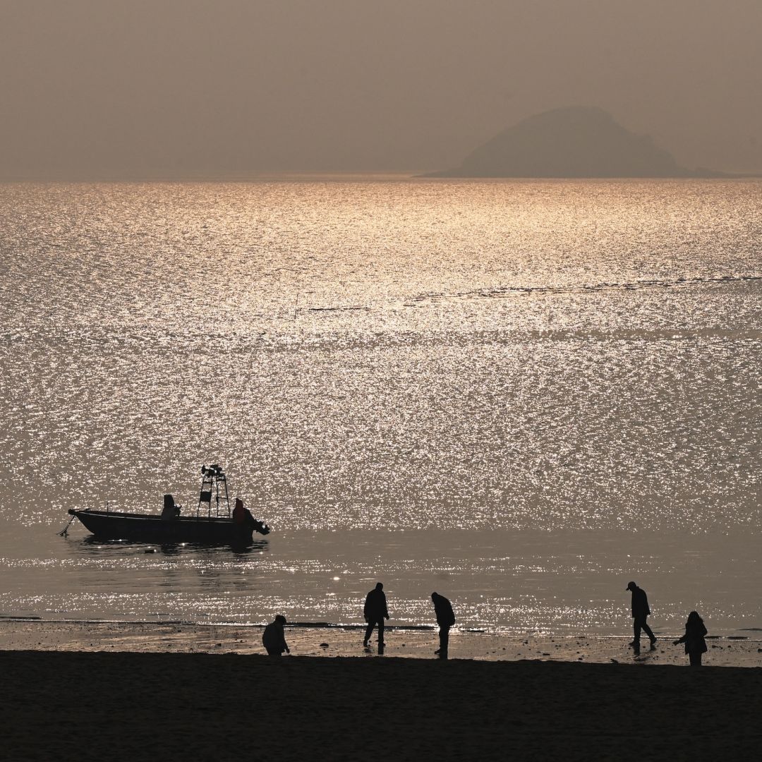 Kinmen Island, the main island of Taiwan's Kinmen archipelago, is seen in the distance from a beach in the southeastern Chinese city of Xiamen on Jan. 12, 2024.