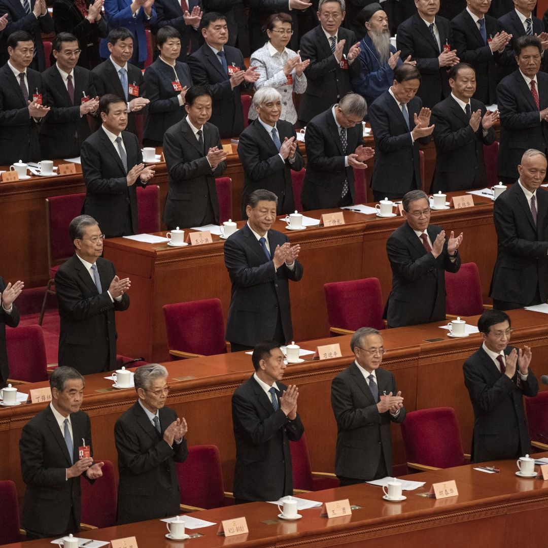 Chinese President Xi Jinping (center) and other senior leaders applaud at the closing session of the Chinese People's Political Consultative Conference, or CPPCC, on March 10, 2024, in Beijing, China. 