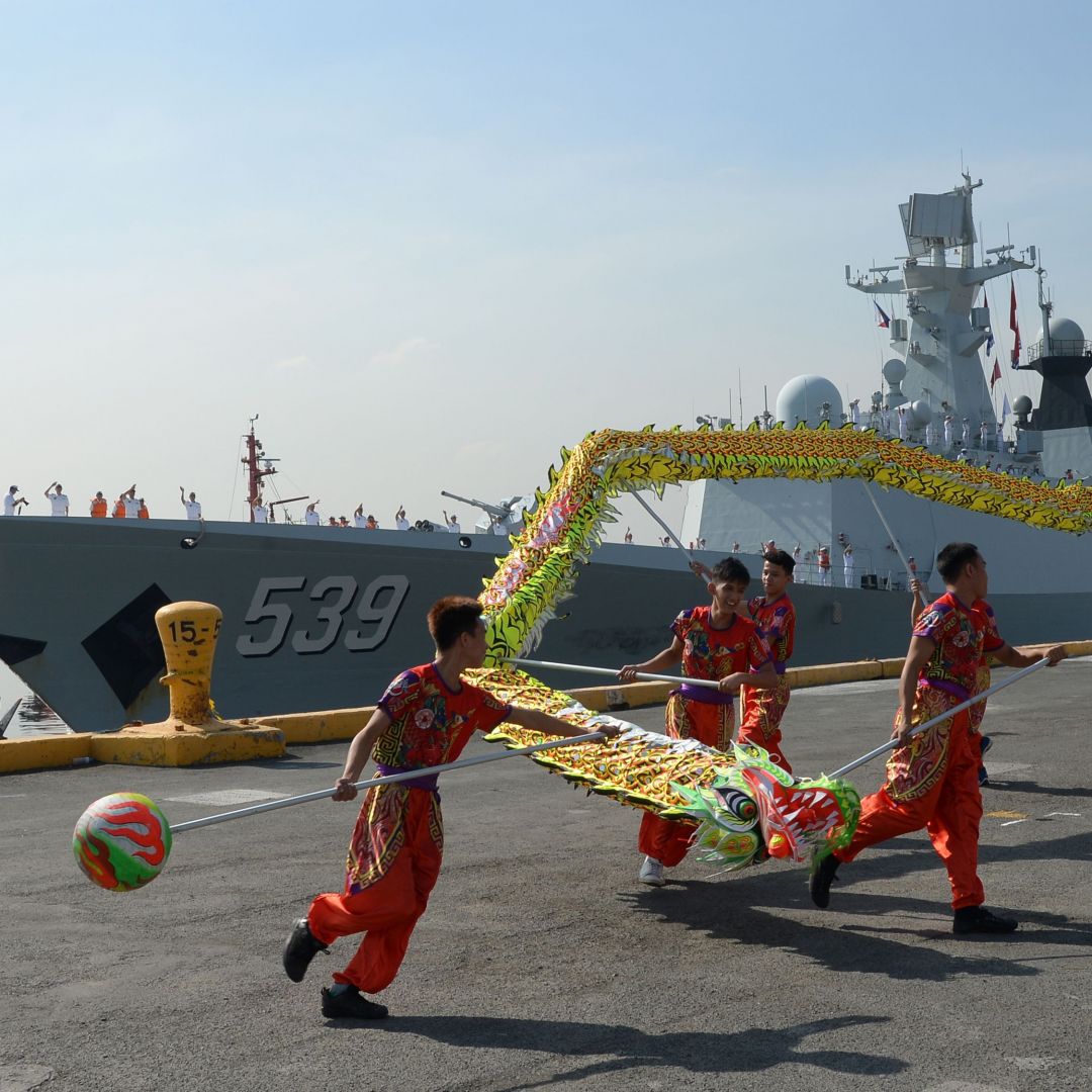 Dragon dancers perform as the Chinese guided-missile frigate Wuhu visits Manila, Philippines, in January 2019.