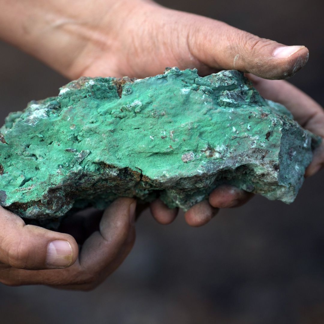 A man holds a copper-rich piece at a mine in Kolwezi, Democratic Republic of Congo, in July 2016. 