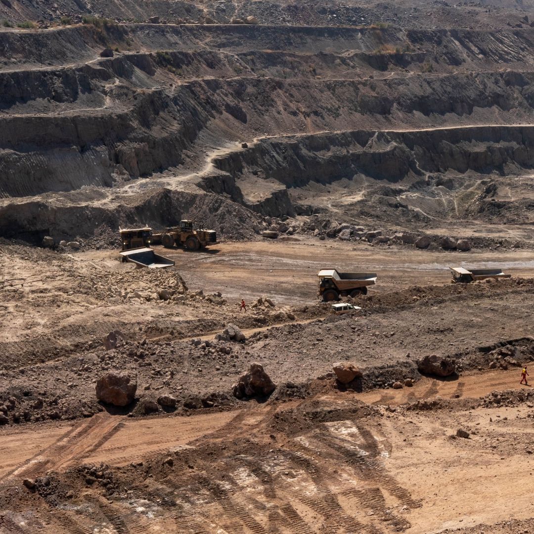 Trucks haul away ore from a pit in the Chinese-owned Tenke Fungurume Mine, one of the largest copper and cobalt mines in the world, in southeastern Democratic Republic of the Congo on June 17, 2023.