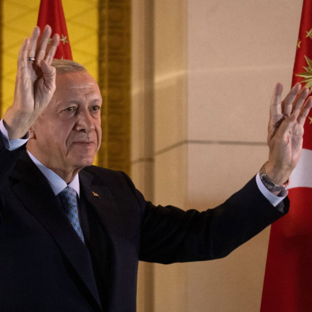 President Recep Tayyip Erdogan waves at supporters at the presidential palace after winning reelection in a runoff on May 29, 2023, in Ankara, Turkey. 
