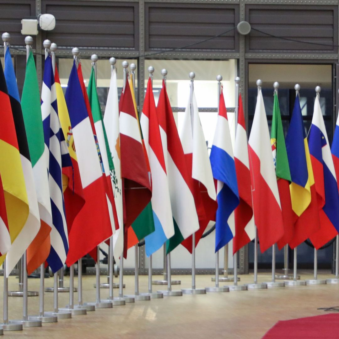 The national flags of the European Union’s 27 member states are seen in the European Council headquarters in Brussels, Belgium. 