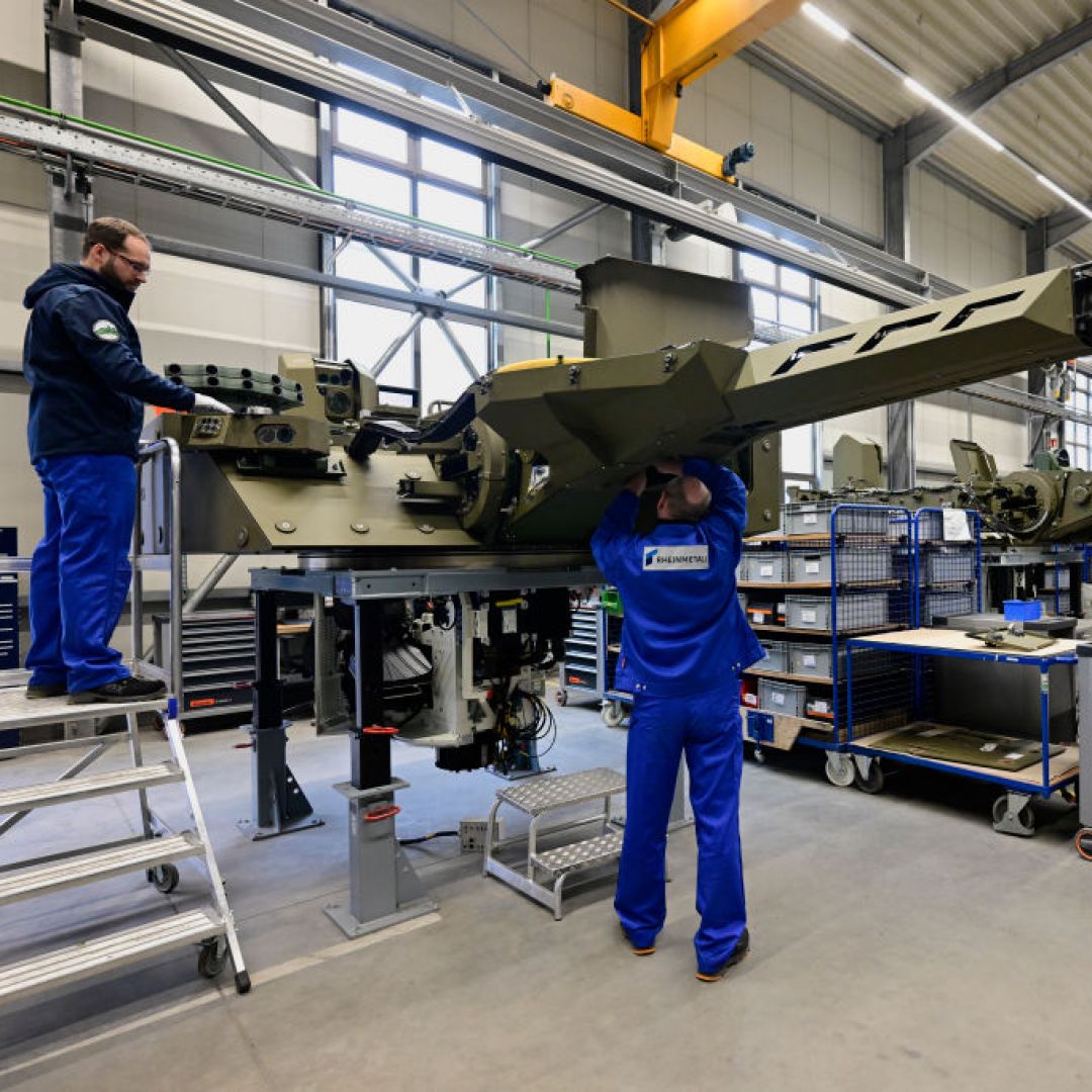 Employees work at a production line as German Chancellor Olaf Scholz and Defence Minister Boris Pistorius attend the groundbreaking ceremony for a new munitions factory of German defense contractor Rheinmetall on Feb. 12, 2024, in Unterluess, Germany. Employees work at a production line as German Chancellor Olaf Scholz and Defence Minister Boris Pistorius attend the groundbreaking ceremony for a new munitions factory of German defense contractor Rheinmetall on Feb. 12, 2024, in Unterluess, Germany.