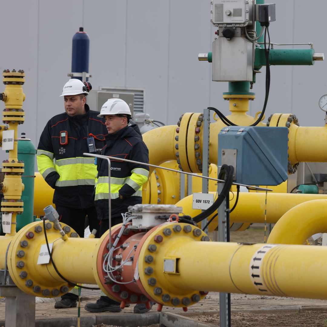 Workers at Polish natural gas company Gaz-System stand among pipes at a compressor station of the new Baltic Pipe natural gas pipeline on the day of its official opening on Sept. 27, 2022, near Goleniow, Poland. Workers at Polish natural gas company Gaz-System stand among pipes at a compressor station of the new Baltic Pipe natural gas pipeline on the day of its official opening on Sept. 27, 2022, near Goleniow, Poland.