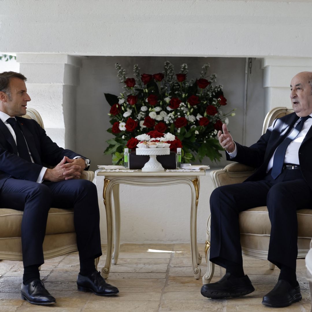 France's President Emmanuel Macron (L) meets with Algeria's President Abdelmadjid Tebboune (R) at the Borgo Egnazia resort on the sidelines of the G7 summit in Savelletri, Italy, on June 13, 2024. 