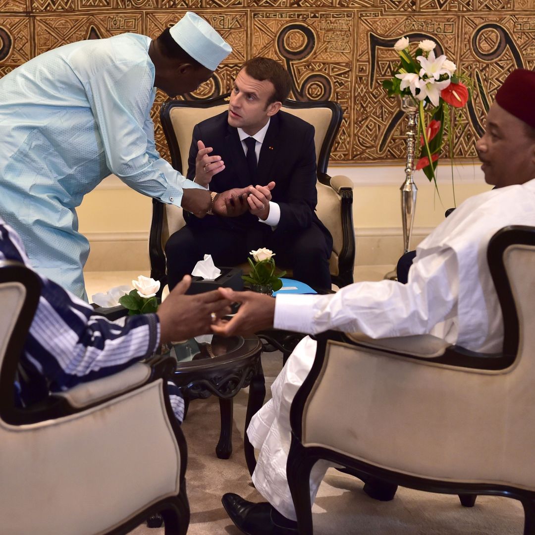 Chad's president Idriss Deby Itno (2nd L) speaks with French President Emmanuel Macron (C) as they gather with President of Burkina Faso Roch Marc Christian Kabore (front L), Mali's President Ibrahim Boubacar Keita (rear L), Niger's President Mahamadou Issoufou (front R) and Mauritanian President Mohamed Ould Abdel Aziz (rear R) for a meeting during the G5 Sahel summit in Bamako, July 2. 