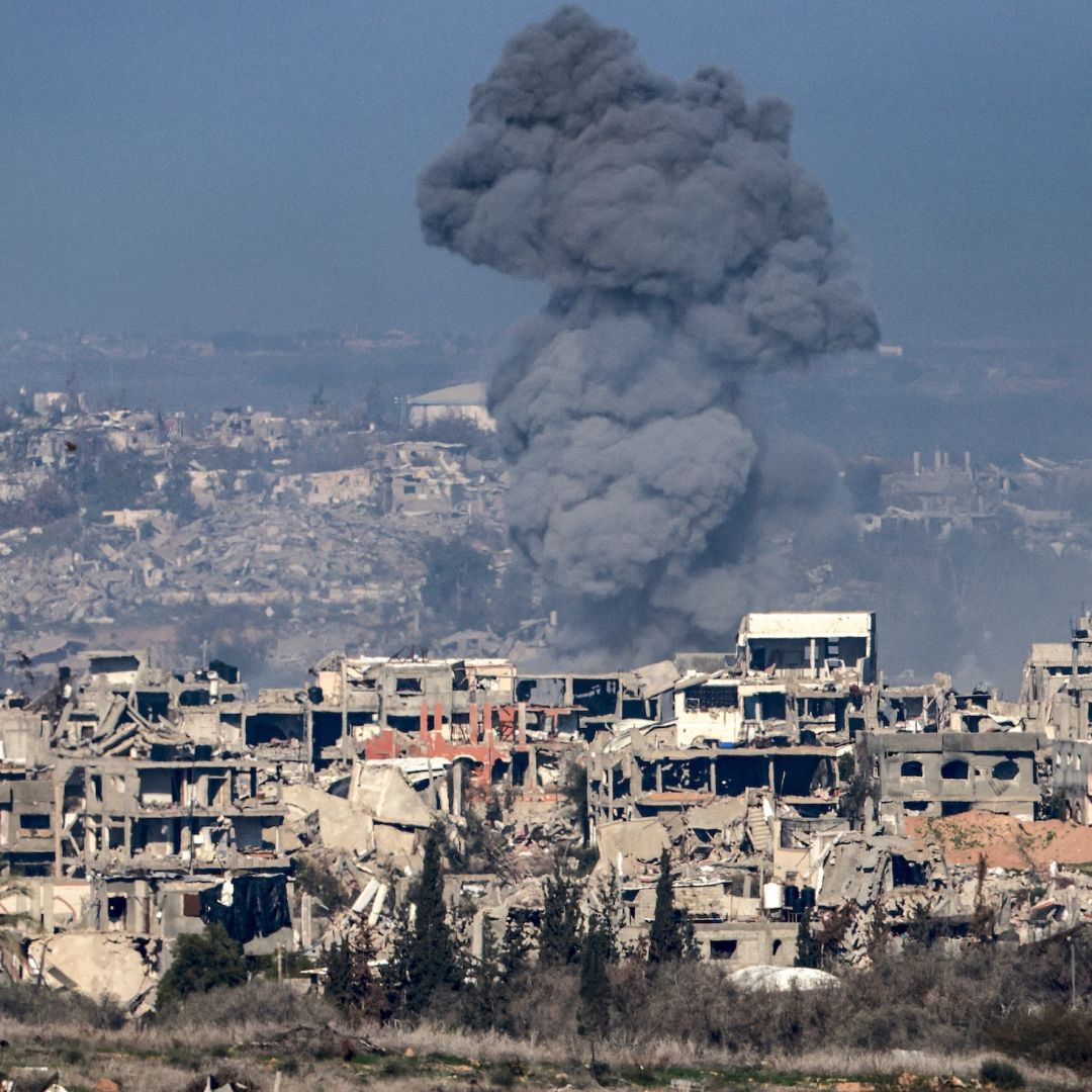 A smoke plume rises above destroyed buildings in northern Gaza on Jan. 13, 2025.