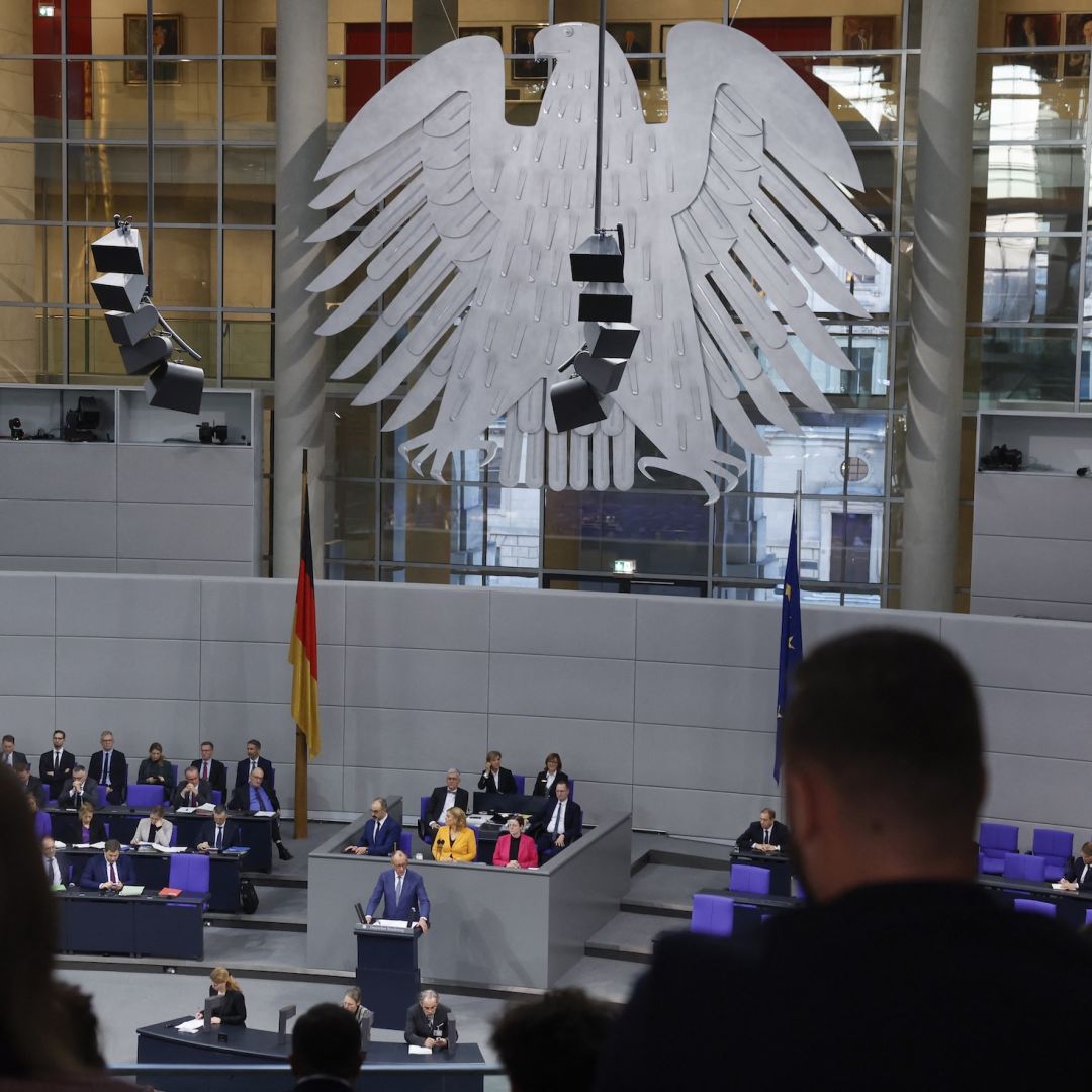 German Chancellor Friedrich Merz addresses the Bundestag on Dec 17 in Berlin.