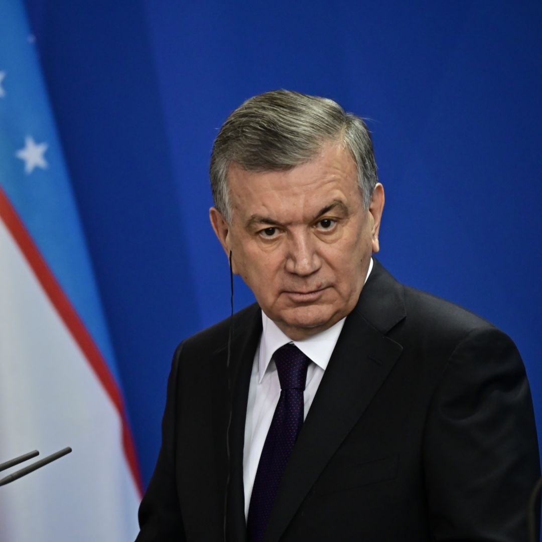 Uzbek President Shavkat Mirziyoyev listens during a joint press conference with German Chancellor Angela Merkel prior to a meeting on Jan. 21, 2019, in Berlin. 