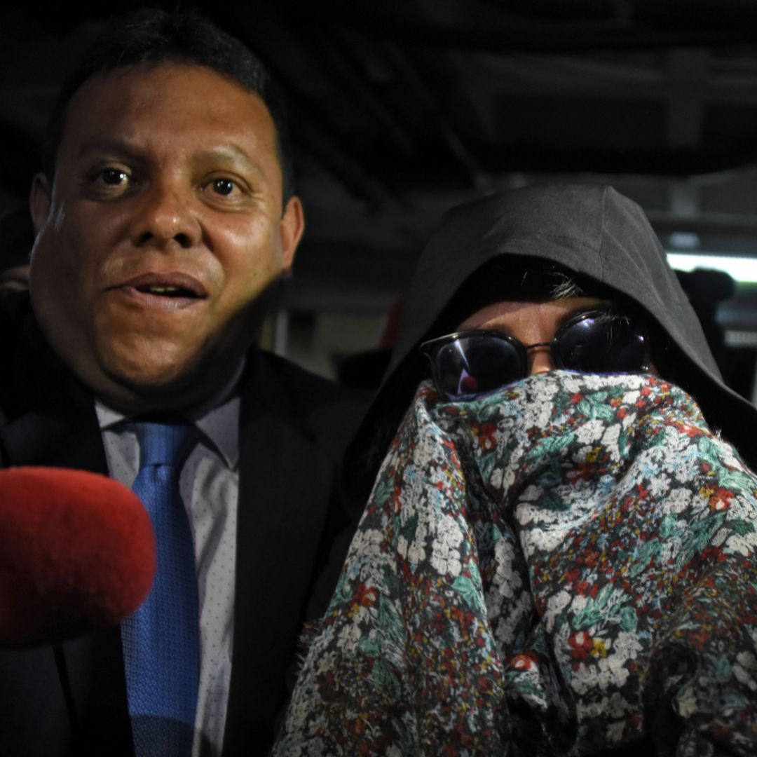 Former Guatemalan first lady Sandra Torres was arrested Sept. 2 after her immunity from prosecution expired following her loss to Alejandro Giammattei in Guatemala's presidential election. Guatemalan police officers escort former presidential candidate Sandra Torres to the Supreme Court in Guatemala City on Sept. 2, 2019, following her arrest on corruption charges.