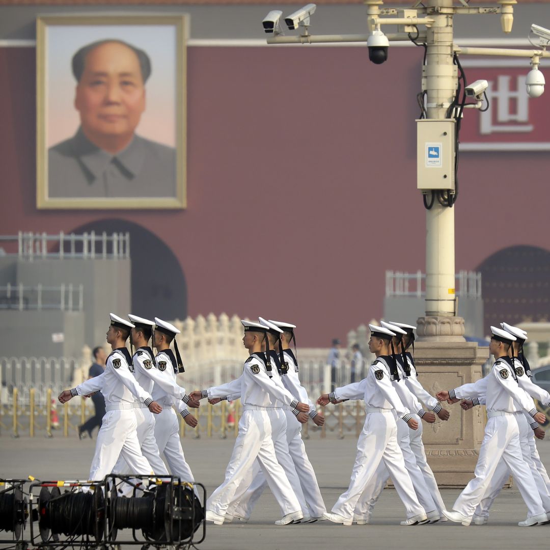 Cadets from China's People's Liberation Army (PLA) Navy march in formation before a ceremony at Tiananmen Square in Beijing on Sept. 30, 2019. 