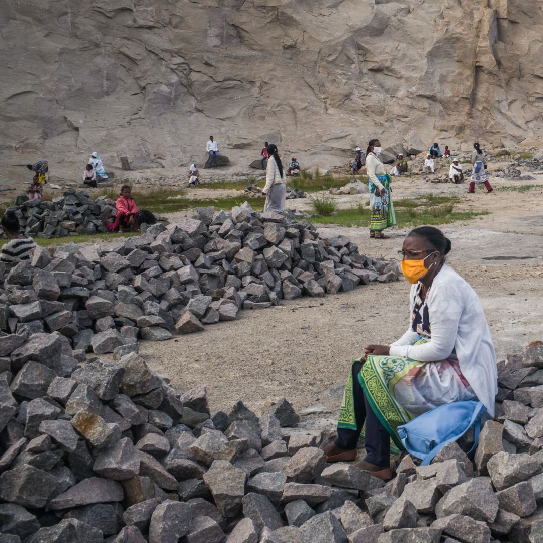 People wearing masks gather in a granite quarry in Antananarivo, Madagascar, for an Easter celebration while practicing social distancing on April 12, 2020. The capital city has been on lockdown since March 23 to curb the spread of COVID-19.