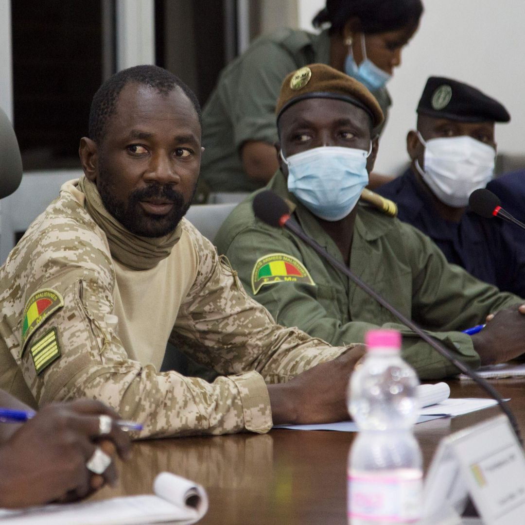 Colonel Assimi Goita (center) sits between other Malian military leaders during a meeting with an Economic Community of West African States (ECOWAS) delegation on Aug. 22, 2020. Goita seized power for the second time in a May 2021 coup. Colonel Assimi Goita (center) sits between other Malian military leaders during a meeting with an Economic Community of West African States (ECOWAS) delegation on Aug. 22, 2020. Goita seized power for the second time in a May 2021 coup.