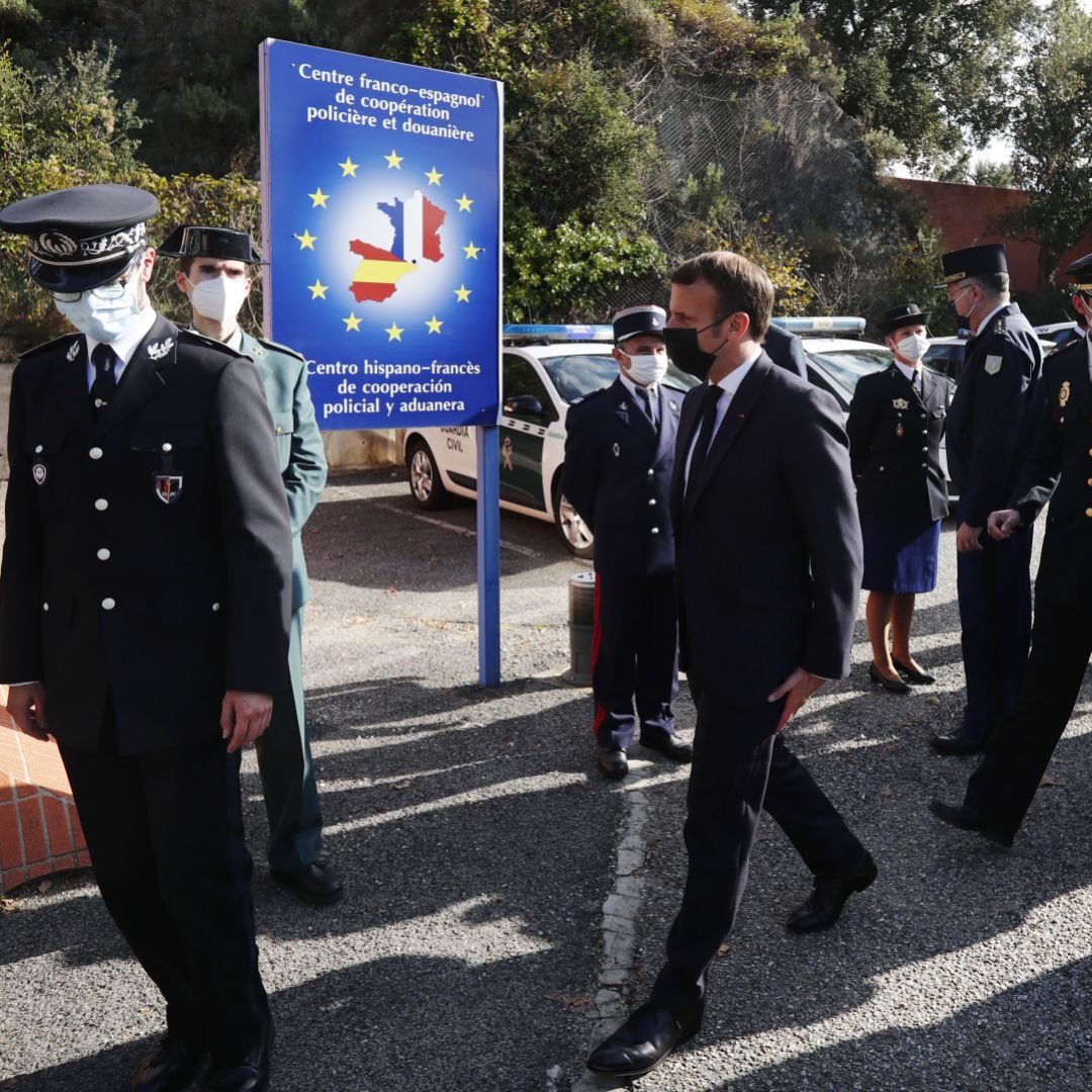 French President Emmanuel Macron (center) arrives at the Spanish border in Le Perthus, France, after he announced that the number of border guards would be doubled to 4,800 from 2,400 "because of the worsening of the threat" from terrorism on Nov. 5, 2020. French President Emmanuel Macron (center) arrives at the Spanish border in Le Perthus, France, after he announced that the number of border guards would be doubled to 4,800 from 2,400 "because of the worsening of the threat" from terrorism on Nov. 5, 2020.