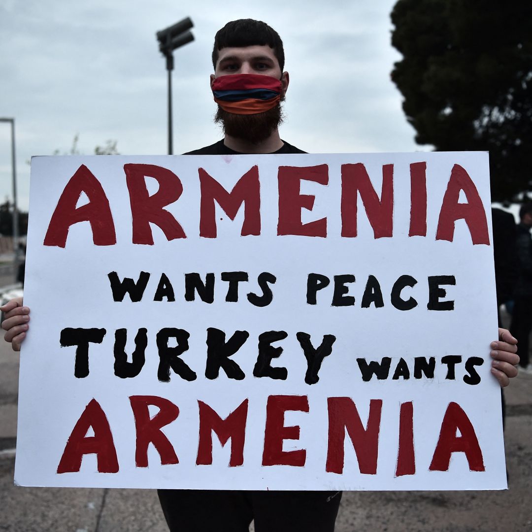 A demonstrator holds a placard during a rally in Thessaloniki, northern Greece on April 24, 2021, to commemorate the 106th anniversary of the Armenian genocide. A demonstrator holds a placard during a rally in Thessaloniki, northern Greece on April 24, 2021, to commemorate the 106th anniversary of the Armenian genocide.