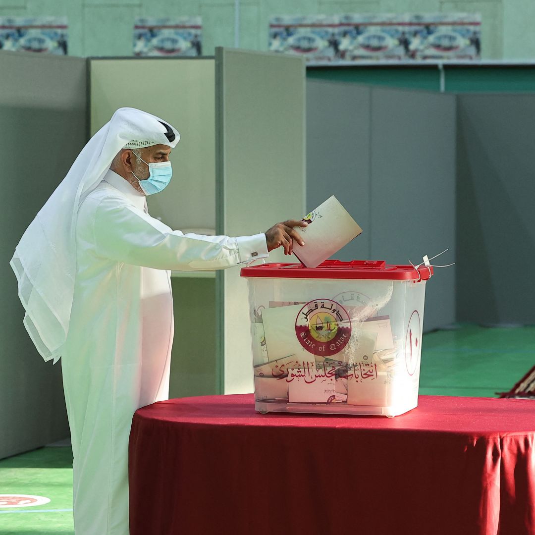 A man casts his ballot in Qatar’s first-ever legislative vote at a polling station in Doha on Oct. 2, 2021. 