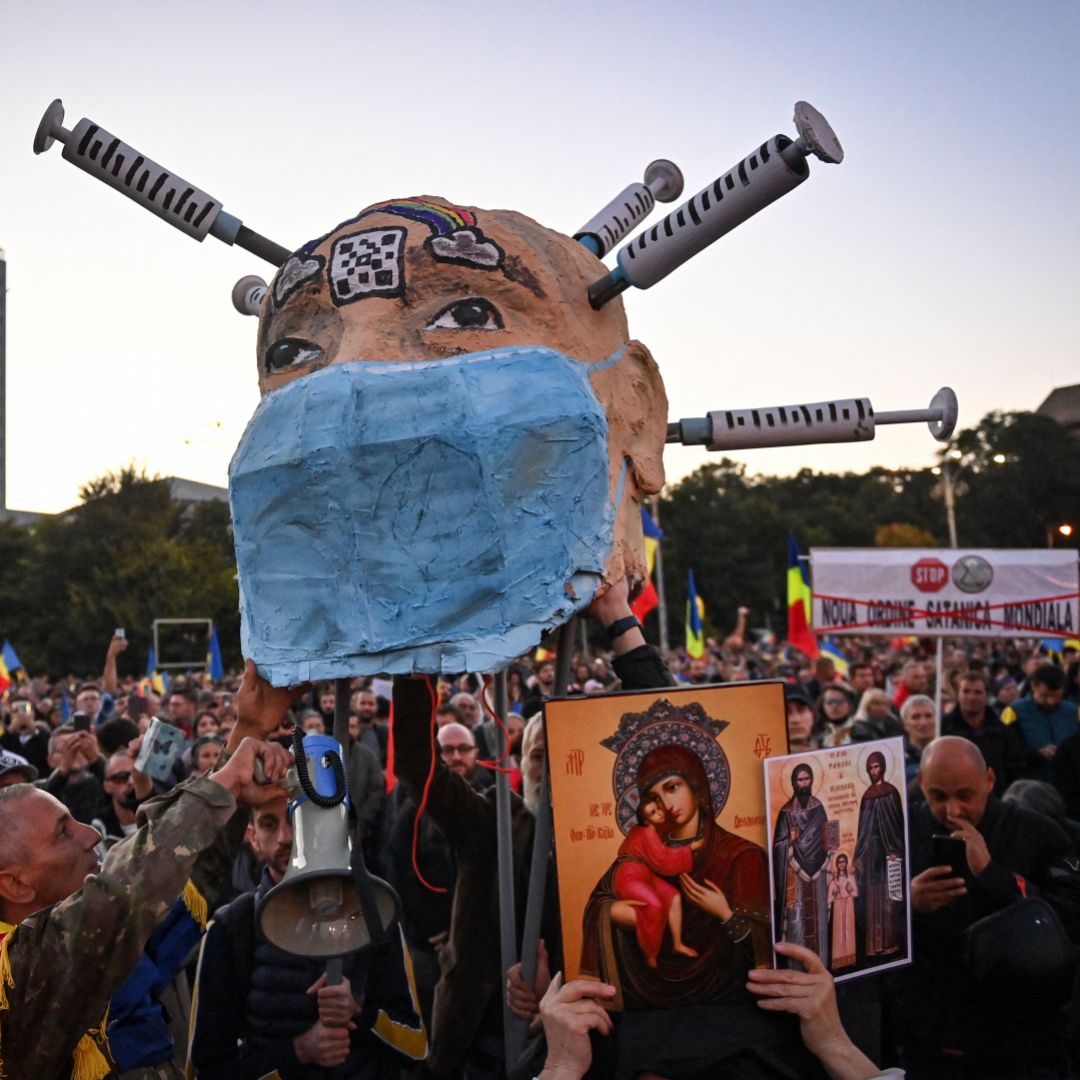 People take part in a protest against COVID-19 vaccines and lockdown measures in Bucharest, Romania, on Oct. 2, 2021. People take part in a protest against COVID-19 vaccines and lockdown measures in Bucharest, Romania, on Oct. 2, 2021.