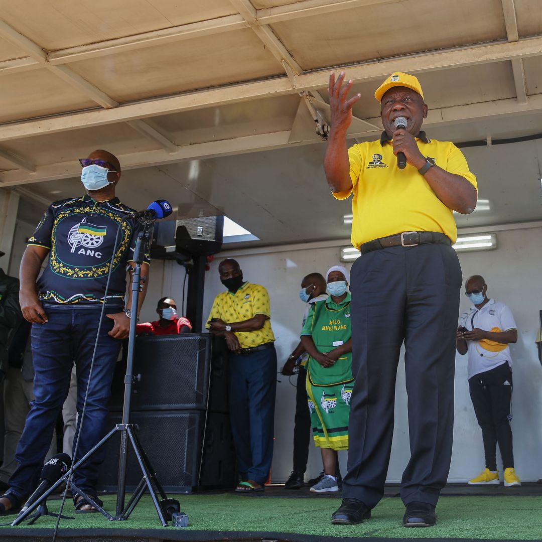 South African President Cyril Ramaphosa (center) addresses supporters of his African National Congress (ANC) party during a rally ahead of local government elections in a township north of Pretoria on Oct. 15, 2021. 