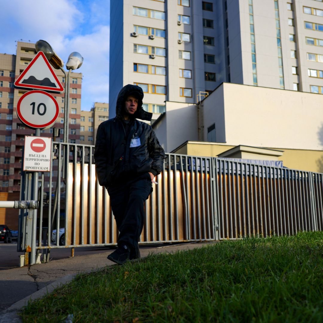 A security guard patrols outside a building that houses the NATO information office in Moscow on Oct. 18, 2021, after Russia announced it was ending the country’s mission to the Western military alliance. 