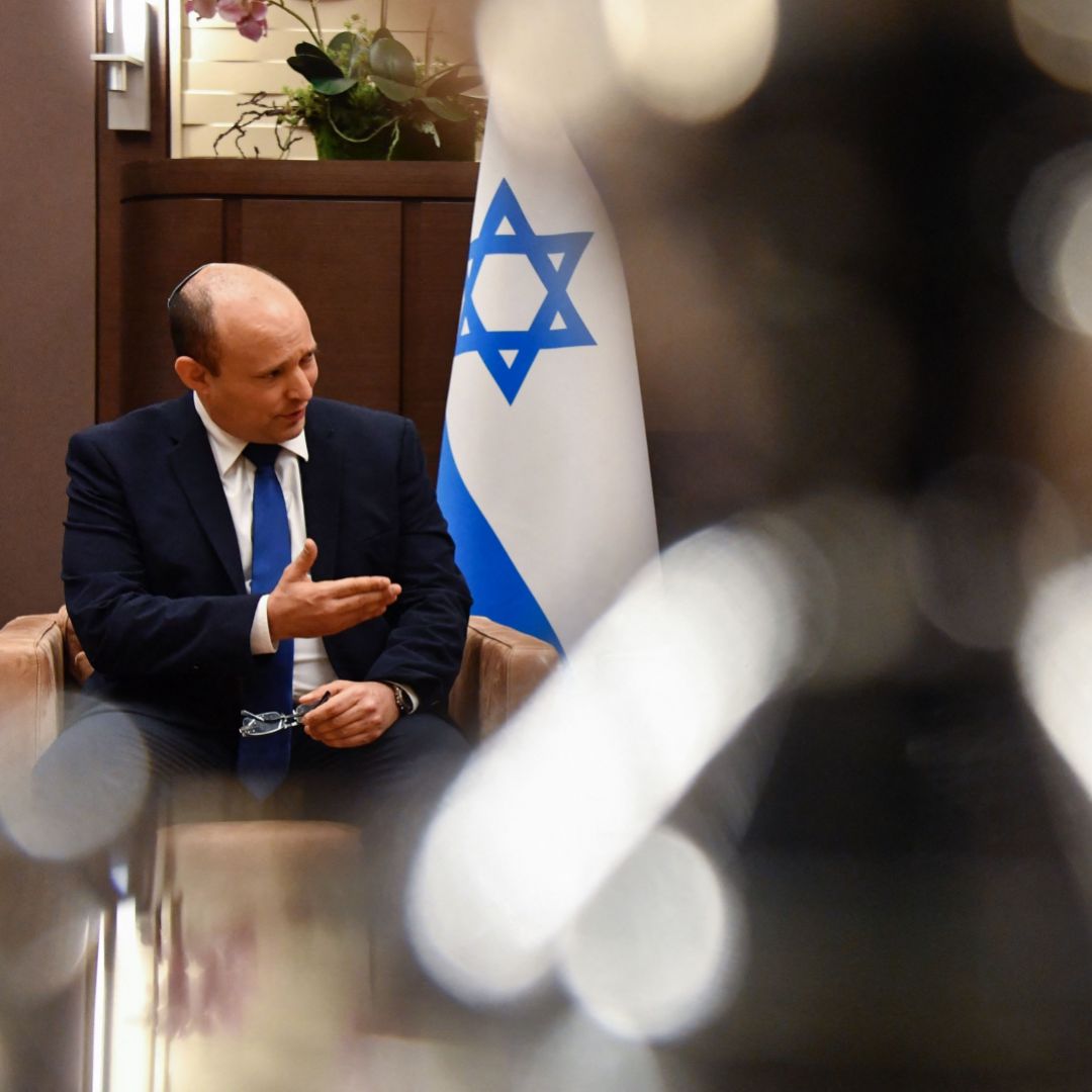 Russian President Vladimir Putin (right) speaks with then-Israeli Prime Minister Naftali Bennett (left) in Sochi, Russia, on Oct. 22, 2021. Russian President Vladimir Putin (right) speaks with then-Israeli Prime Minister Naftali Bennett in Sochi, Russia, on Oct. 22 2021.