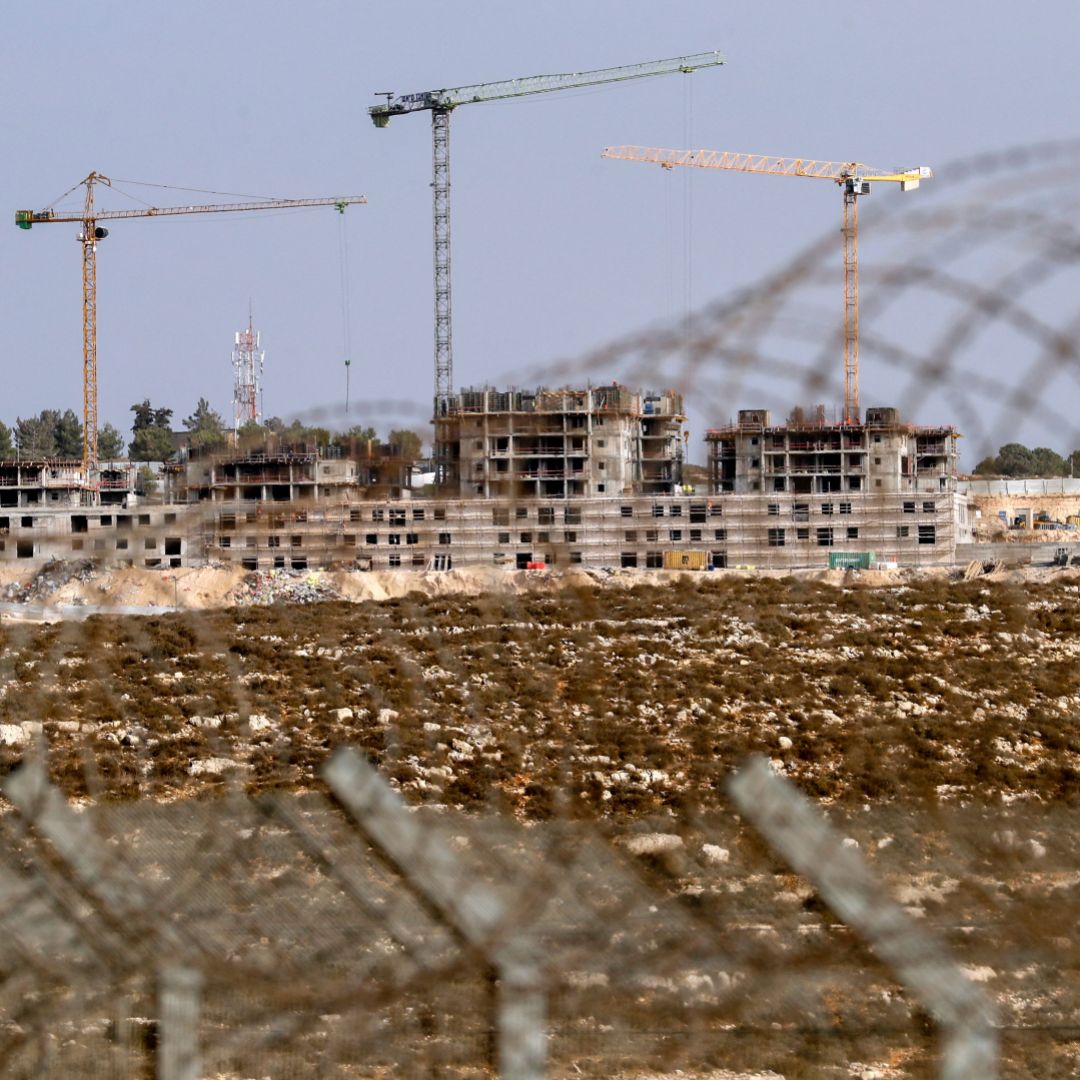 A photo taken on Oct. 28, 2021, shows ongoing construction work in an Israeli settlement near the Palestinian city of Ramallah in the West Bank. 
