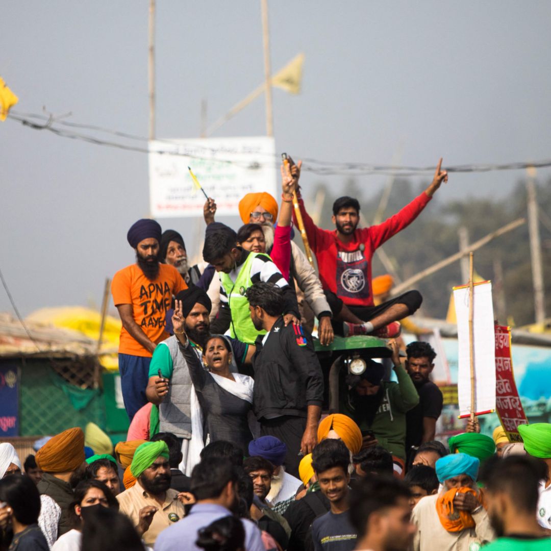 Farmers in India celebrate on Nov. 19, 2021, after the government announced it was repealing the controversial agricultural reforms that sparked nearly a year of protests in the country. Farmers in India celebrate on Nov. 19, 2021, after the government announced it was repealing the controversial agricultural reforms that sparked nearly a year of protests in the country.
