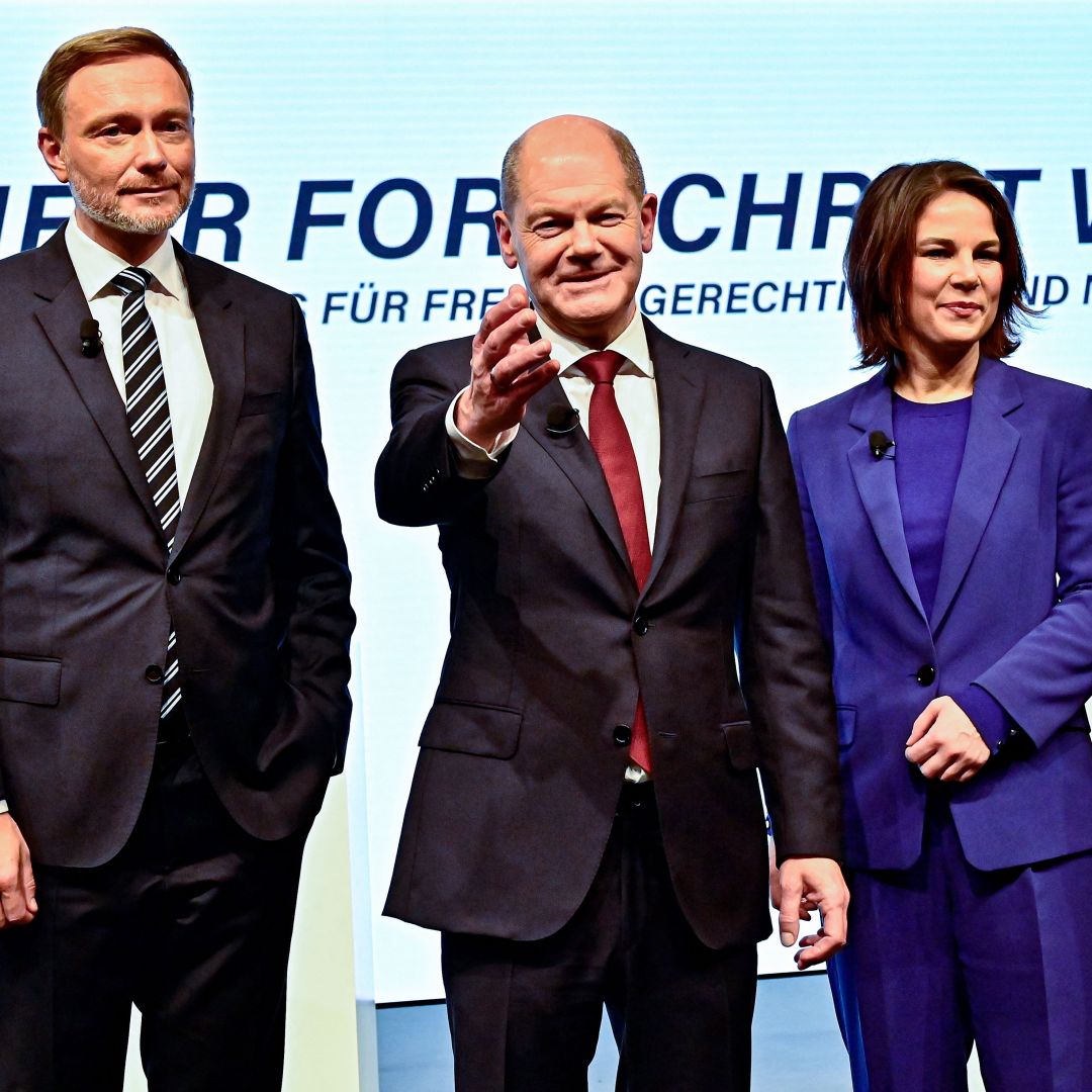 FDP leader Christian Lindner, SPD leader Olaf Scholz and the co-leaders of Germany's Greens party Annalena Baerbock and Robert Habeck (left to right) pose during a press conference in Berlin after presenting their coalition agreement on Nov. 24, 2021. 