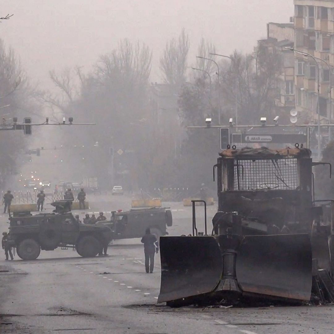 Servicemen and their military vehicles block a street in Almaty, Kazakhstan, on Jan. 7, 2022, following violent protests in the city. Servicemen and their military vehicles block a street in Almaty, Kazakhstan, on Jan. 7, 2022, following violent protests in the city.