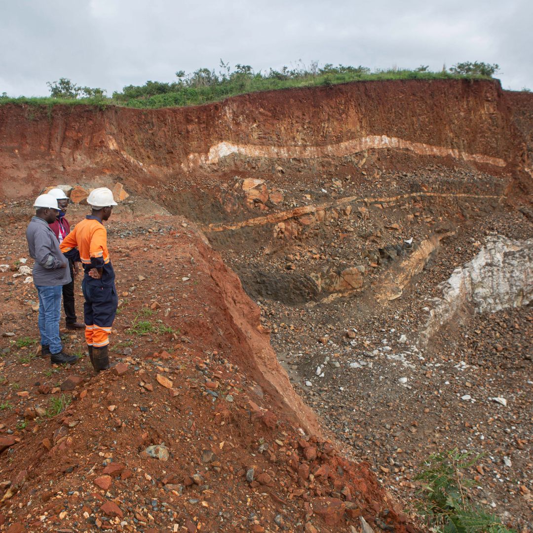 Workers inspect an open cast at the Arcadia lithium mine in Goromonzi, Zimbabwe, on Jan. 11, 2022. 