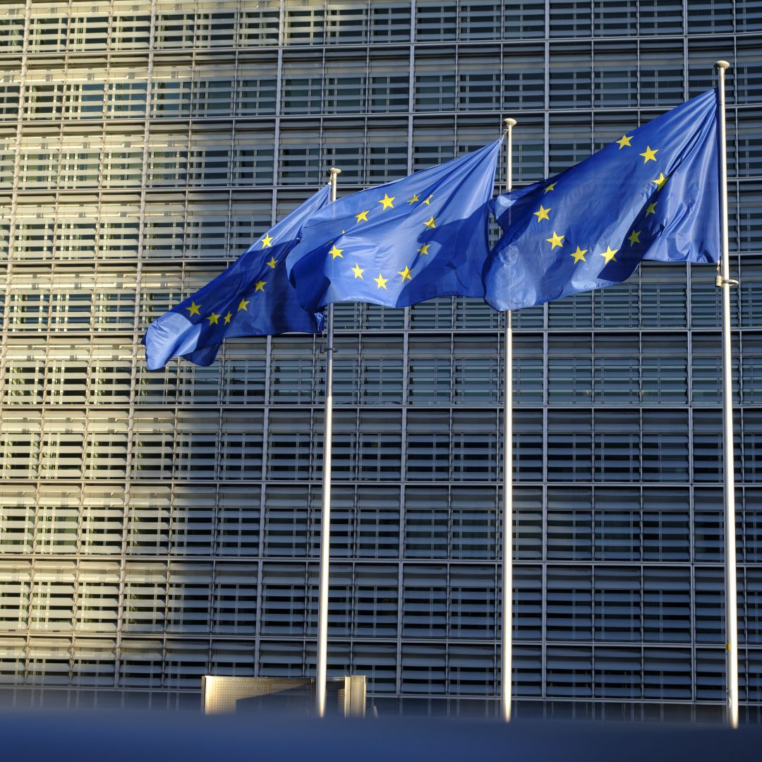 EU flags fly outside the headquarters of the European Commission on Feb. 23, 2022, in Brussels, Belgium. 