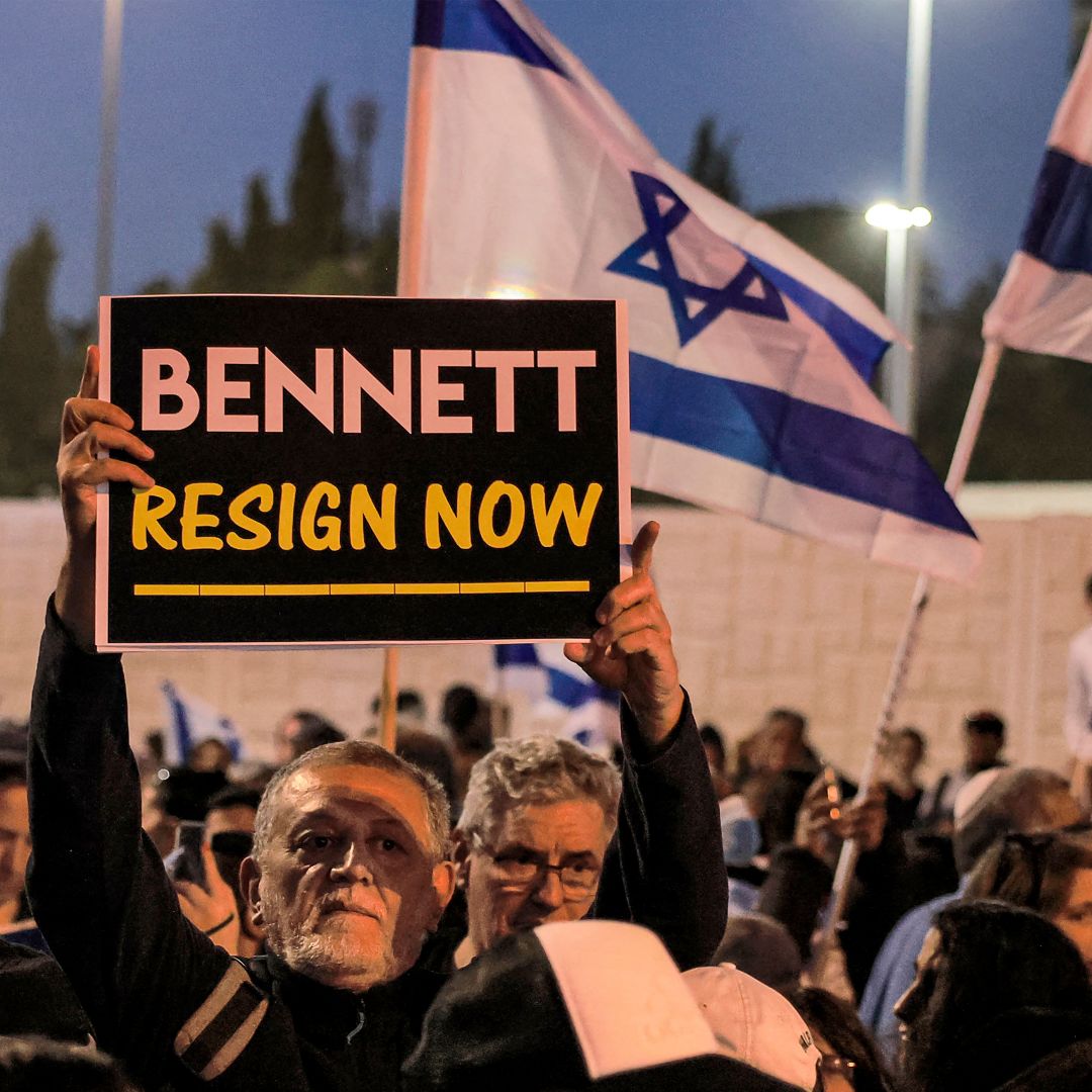 A man holds up a sign during an anti-government protest staged by Israeli right-wing supporters in Jerusalem, Israel, on April 6, 2022. 