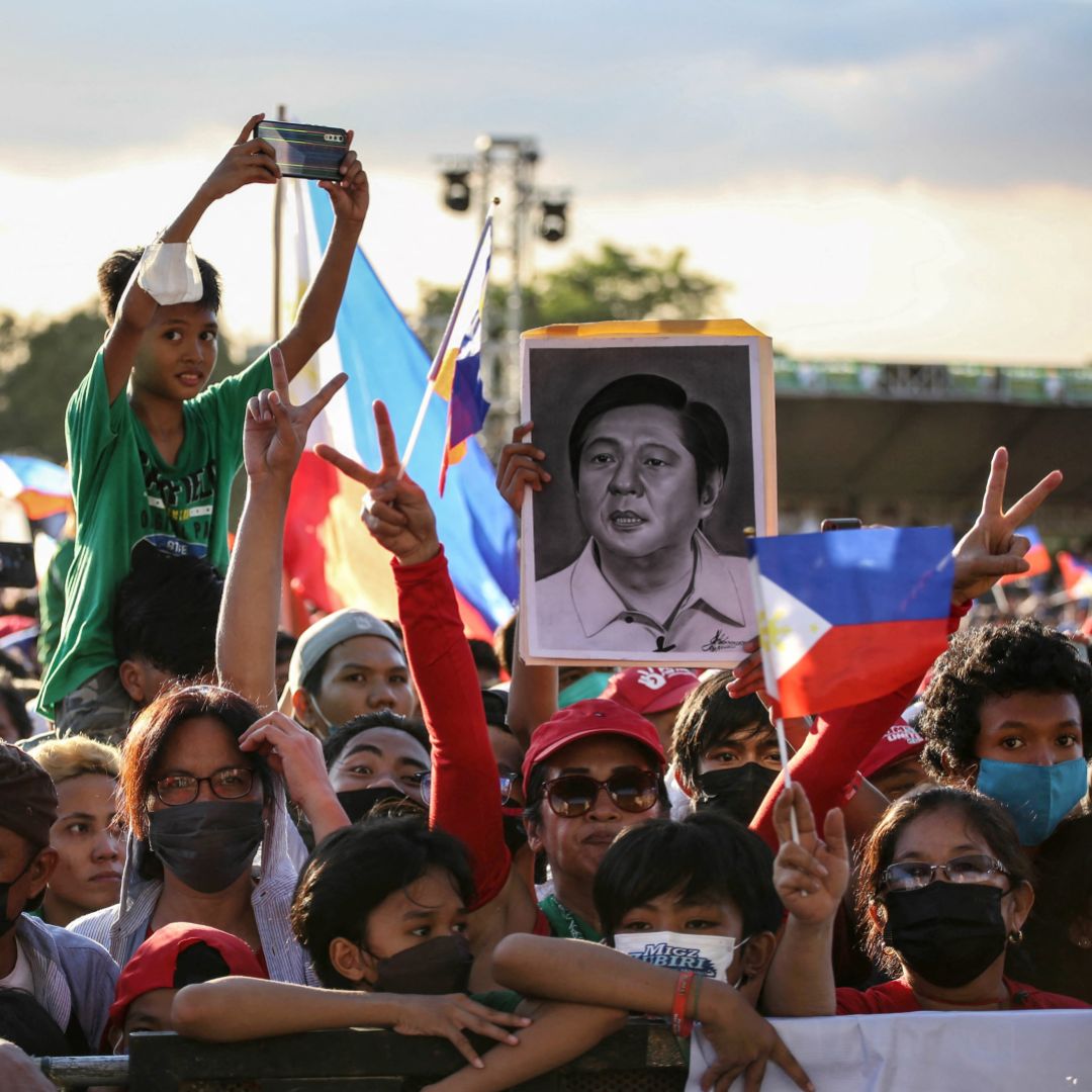 Supporters of Philippine presidential candidate Ferdinand Marcos Jr., son of the country's late dictator, attend a campaign rally in a Manila suburb on April 24, 2022. Supporters of Philippine presidential candidate Ferdinand Marcos Jr., son of the country's late dictator, attend a campaign rally in a Manila suburb on April 24, 2022.
