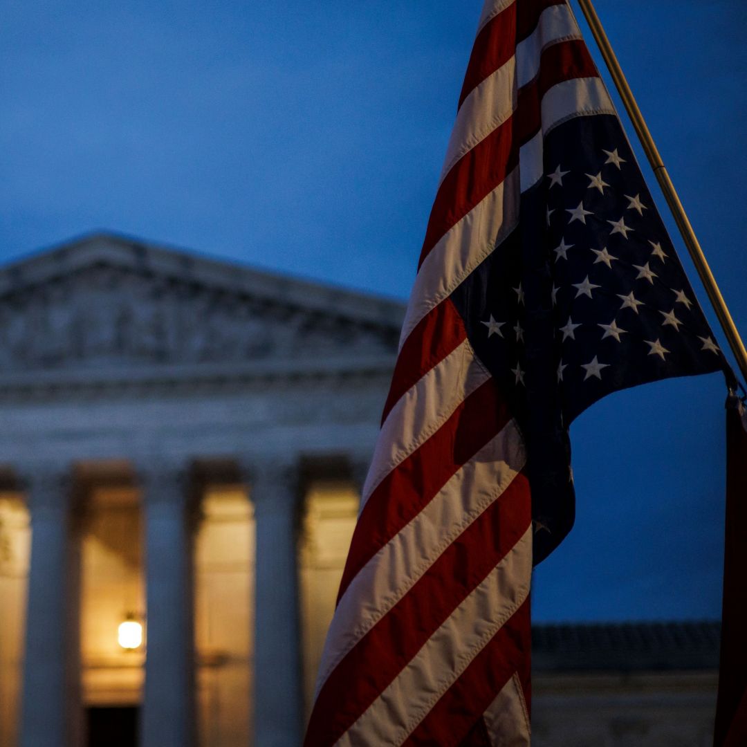 An abortion rights activist flies an upside-down U.S. flag, the international sign of distress, outside of the U.S. Supreme Court during a protest in Washington, D.C., on June 26, 2022, after the landmark Roe v. Wade decision was overturned. An abortion rights activist flies an upside-down U.S. flag, the international sign of distress, outside of the U.S. Supreme Court during a protest in Washington, D.C., on June 26, 2022, after the landmark Roe v. Wade decision was overturned.