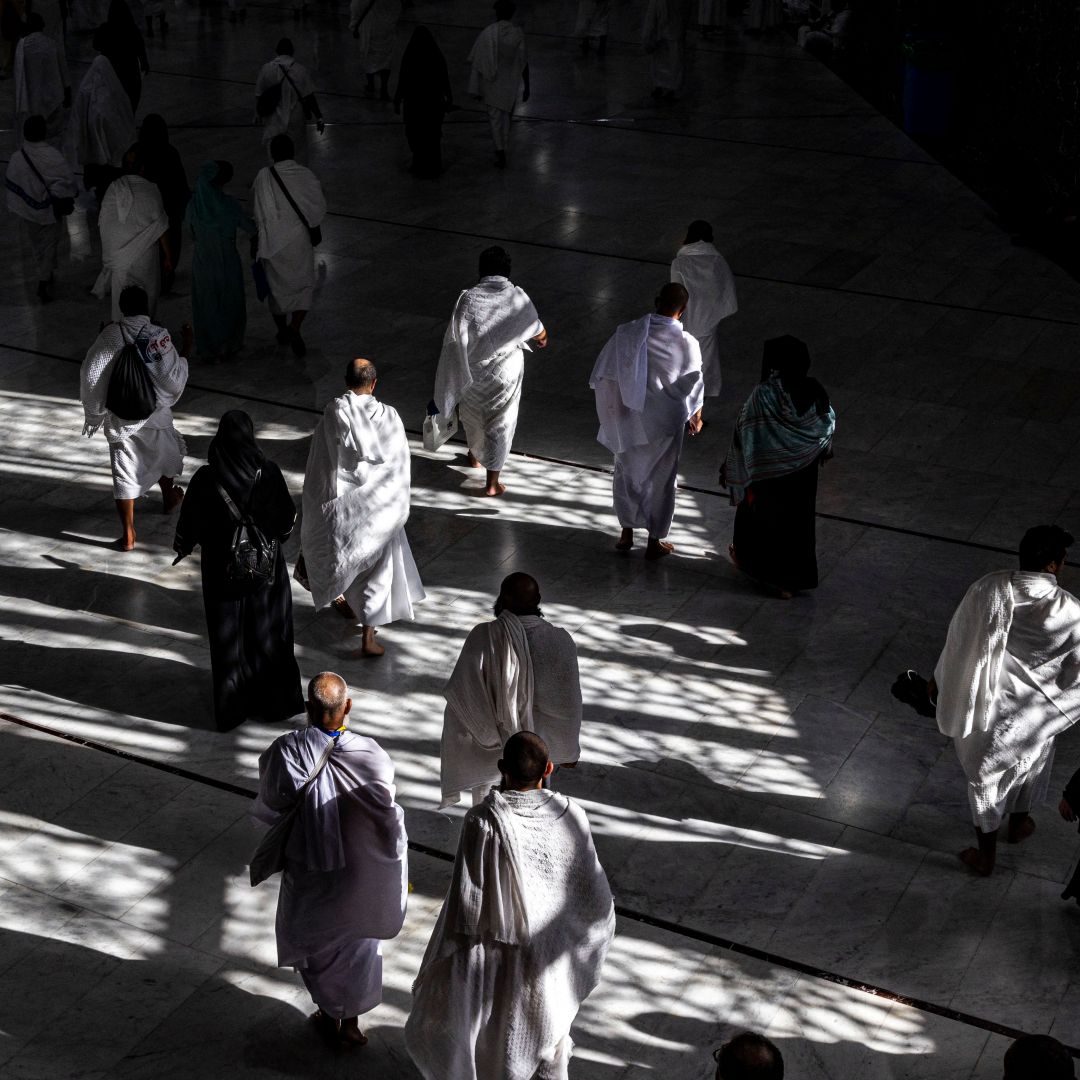 Muslim pilgrims walk at the Grand Mosque in Saudi Arabia's holy city of Mecca on July 6, 2022 during the annual hajj pilgrimage. 