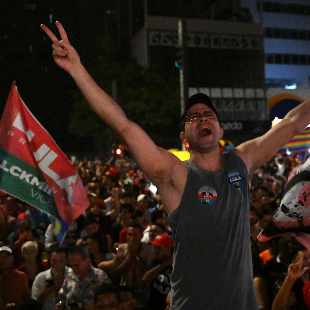A supporter of Brazil's former left-wing president Luiz Inacio Lula da Silva celebrates on a street in Sao Paulo after da Silva was declared the winner of the country's presidential election on Oct. 30, 2022. 