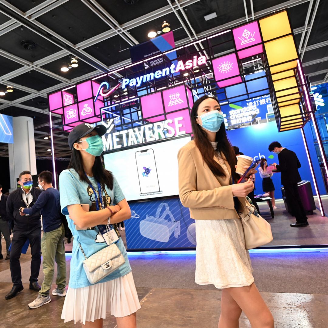 Visitors walk past a metaverse stand during Fintech Week 2022 in Hong Kong on Nov. 1, 2022. Visitors walk past a metaverse stand during Fintech Week 2022 in Hong Kong on Nov. 1, 2022.