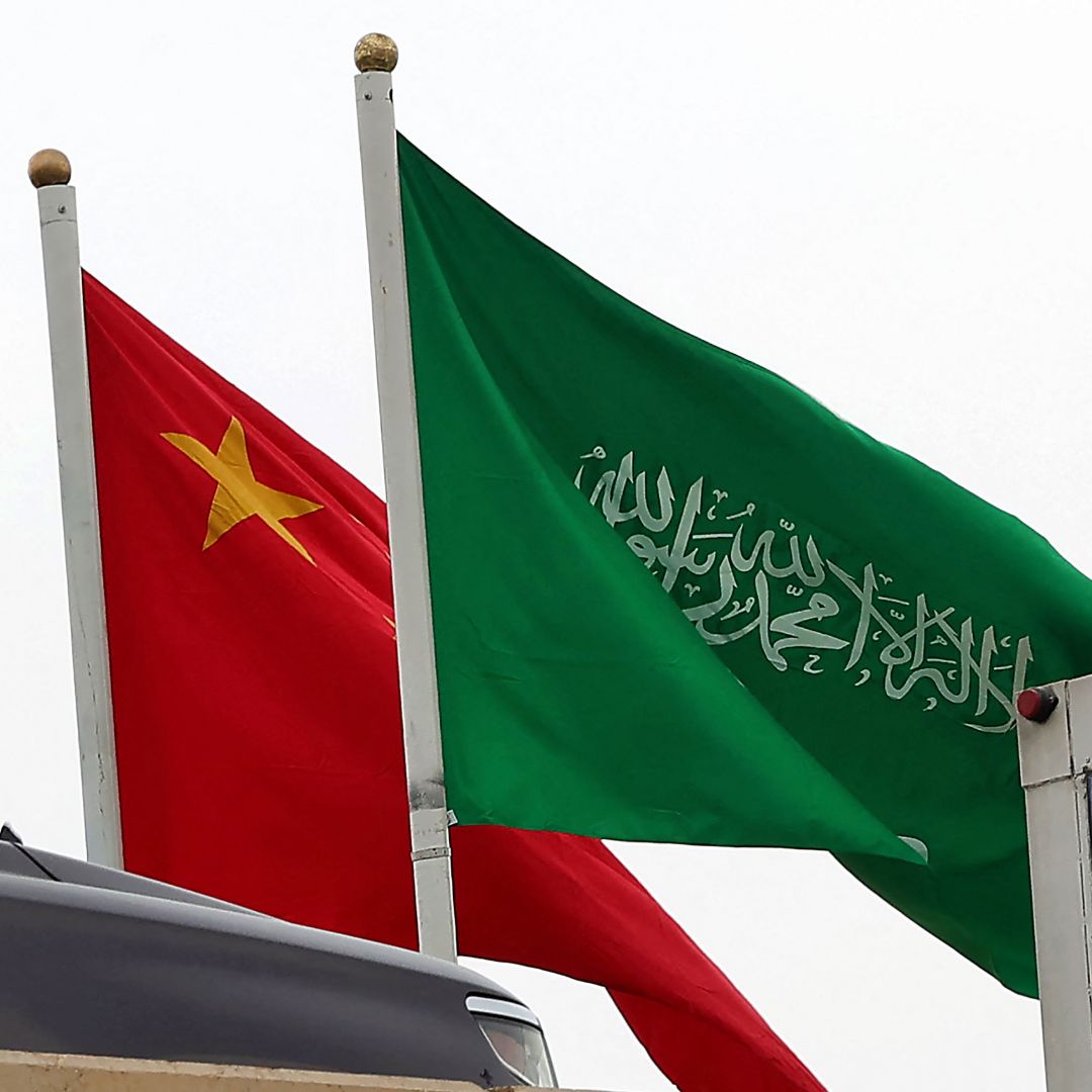The Chinese and Saudi flags wave on a street in Riyadh on Dec. 7, 2022, ahead of Chinese President Xi Jinping's three-day visit to the Saudi capital. 