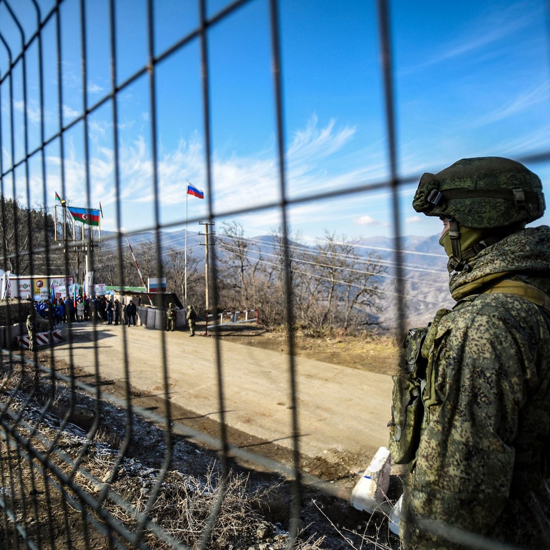 A Russian peacekeeper guards the Lachin Corridor, the breakaway Nagorno-Karabakh region's only land link with Armenia, on Dec. 27, 2022. 