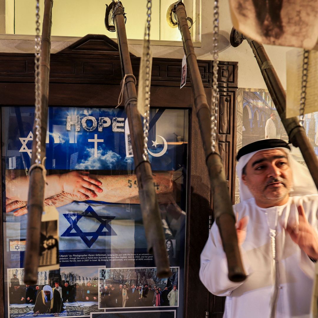 The director of the Crossroads of Civilizations Museum in Dubai, the United Arab Emirates, shows visitors around the facility’s Holocaust Gallery on Jan. 11, 2023.