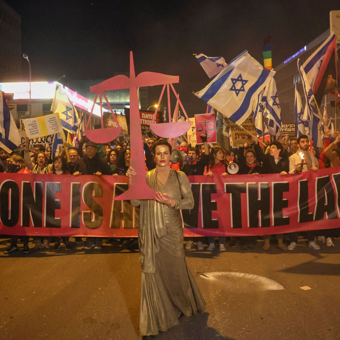 People march on a street in Tel Aviv, Israel, on Feb. 11, 2023, to protest against controversial judicial reforms being touted by the country's right-wing government. People march on a street in Tel Aviv, Israel, on Feb. 11, 2023, to protest against controversial judicial reforms being touted by the country's right-wing government.