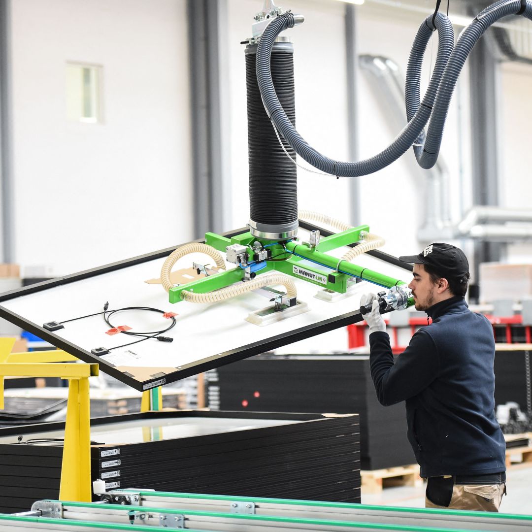 An employee works on a solar panel production line at a factory owned by the French company Systovi in Carquefou, France, on March 6, 2023. An employee works on a solar panel production line at a factory owned by the French company Systovi in Carquefou, France, on March 6, 2023.