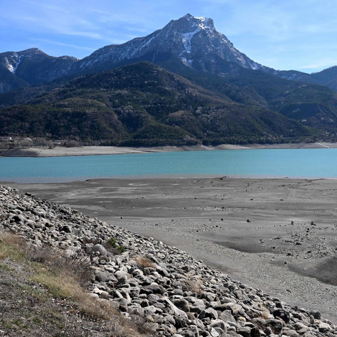 A photograph taken on March 16, 2023, shows Lake Serre-Poncon partially dry, near Embrun, in the French Alps. A photograph taken on March 16, 2023, shows Lake Serre-Poncon partially dry, near Embrun, in the French Alps.