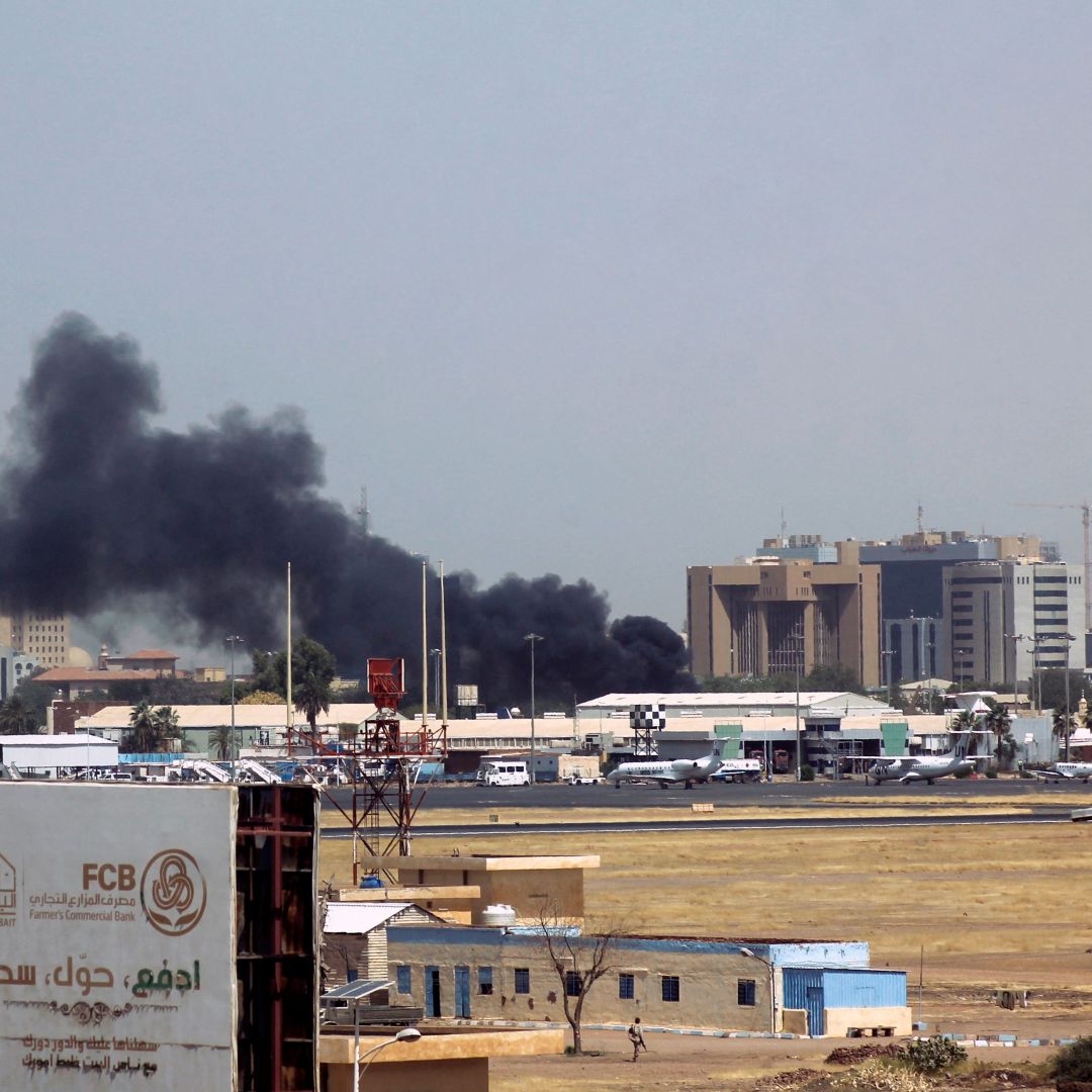Heavy smoke billows above buildings near the Khartoum airport on April 15, 2023, amid clashes between the army and paramilitary troops. Heavy smoke billows above buildings near the Khartoum airport on April 15, 2023, amid clashes between the army and paramilitary troops.