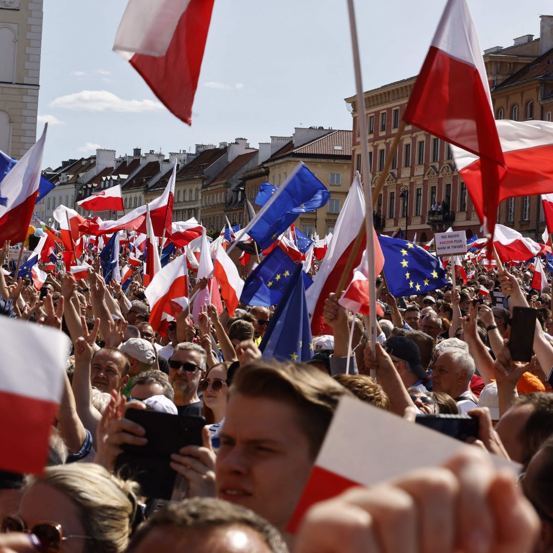 People wave EU and Polish flags during an anti-government rally organized by the opposition in Warsaw, Poland, on June 4, 2023. People wave EU and Polish flags during an anti-government rally organized by the opposition in Warsaw, Poland, on June 4, 2023.