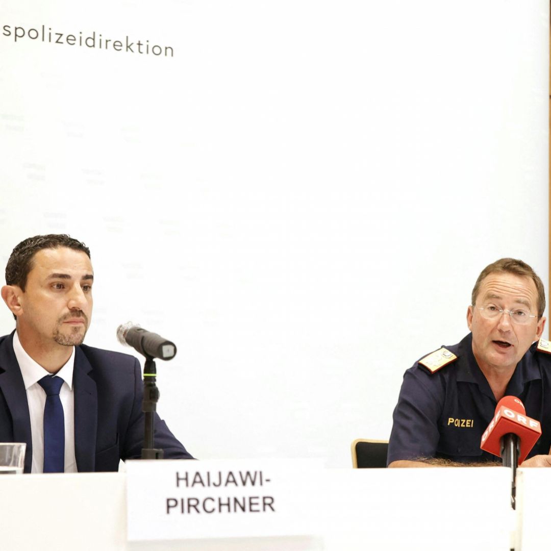 The director of Austria's intelligence agency (left) and the president of Vienna's state police hold a press conference on a foiled Vienna pride parade attack on June 18, 2023. 