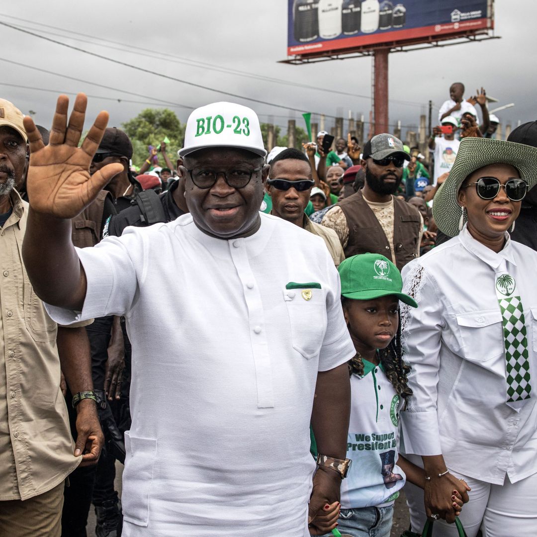 Sierra Leone's president, Julius Maada Bio, waves to his supporters upon arriving at a campaign rally in Freetown on June 20, 2023, ahead of the country's general election. 