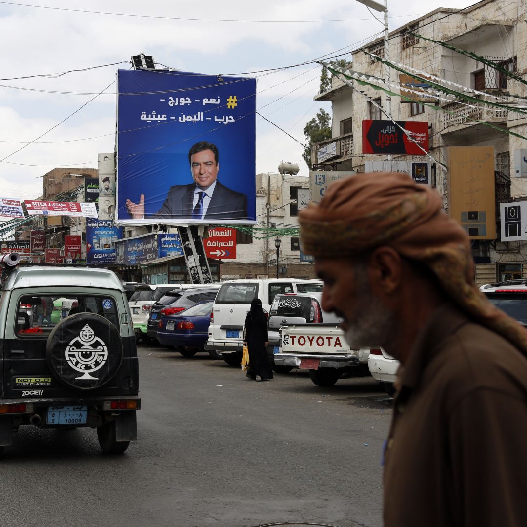 A portrait of Lebanese Information Minister George Kordahi is seen on a billboard in Sanaa, Yemen, on Oct. 31, 2021. 