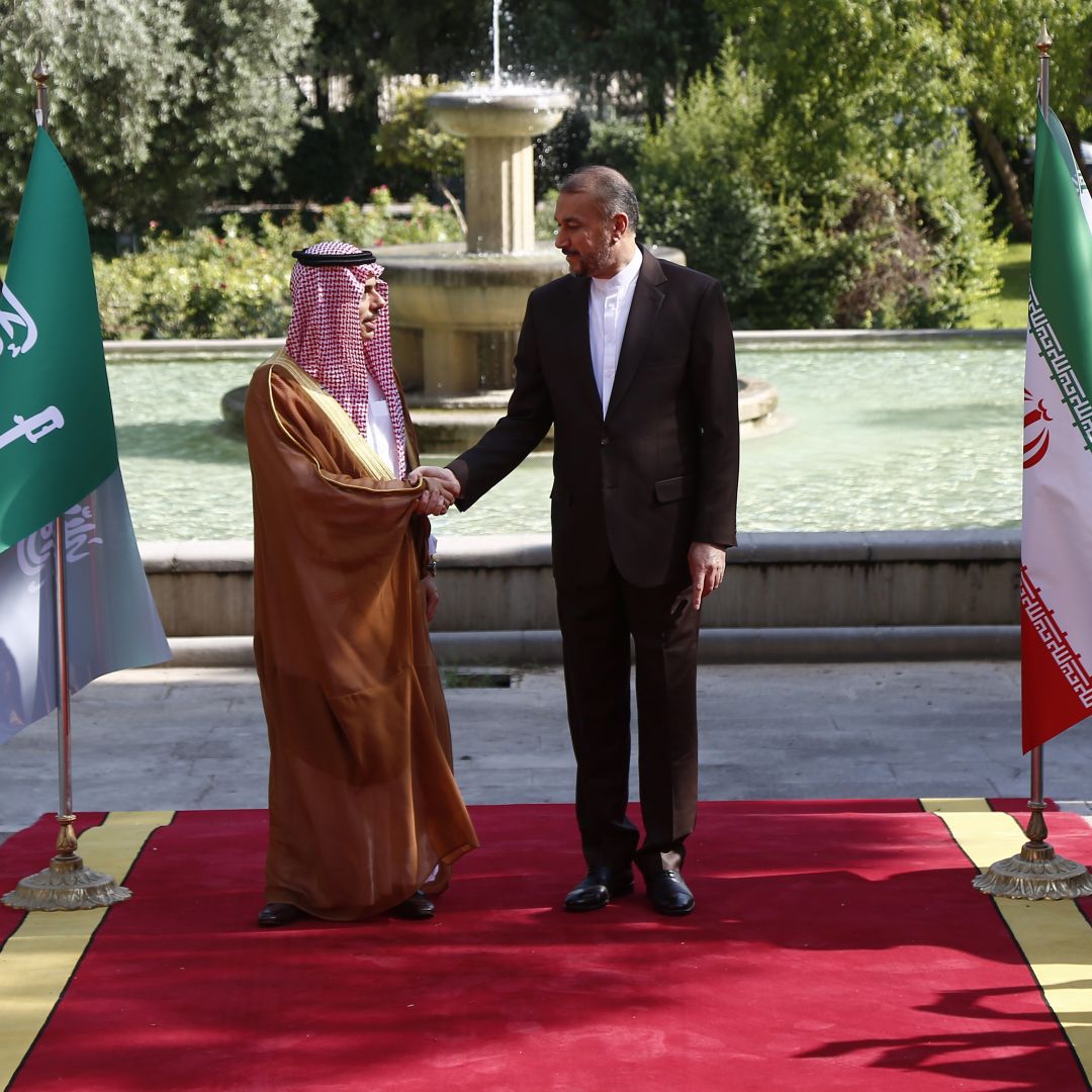 Iran’s foreign minister (right) poses for a picture with his Saudi counterpart on June 17, 2023, in Tehran.