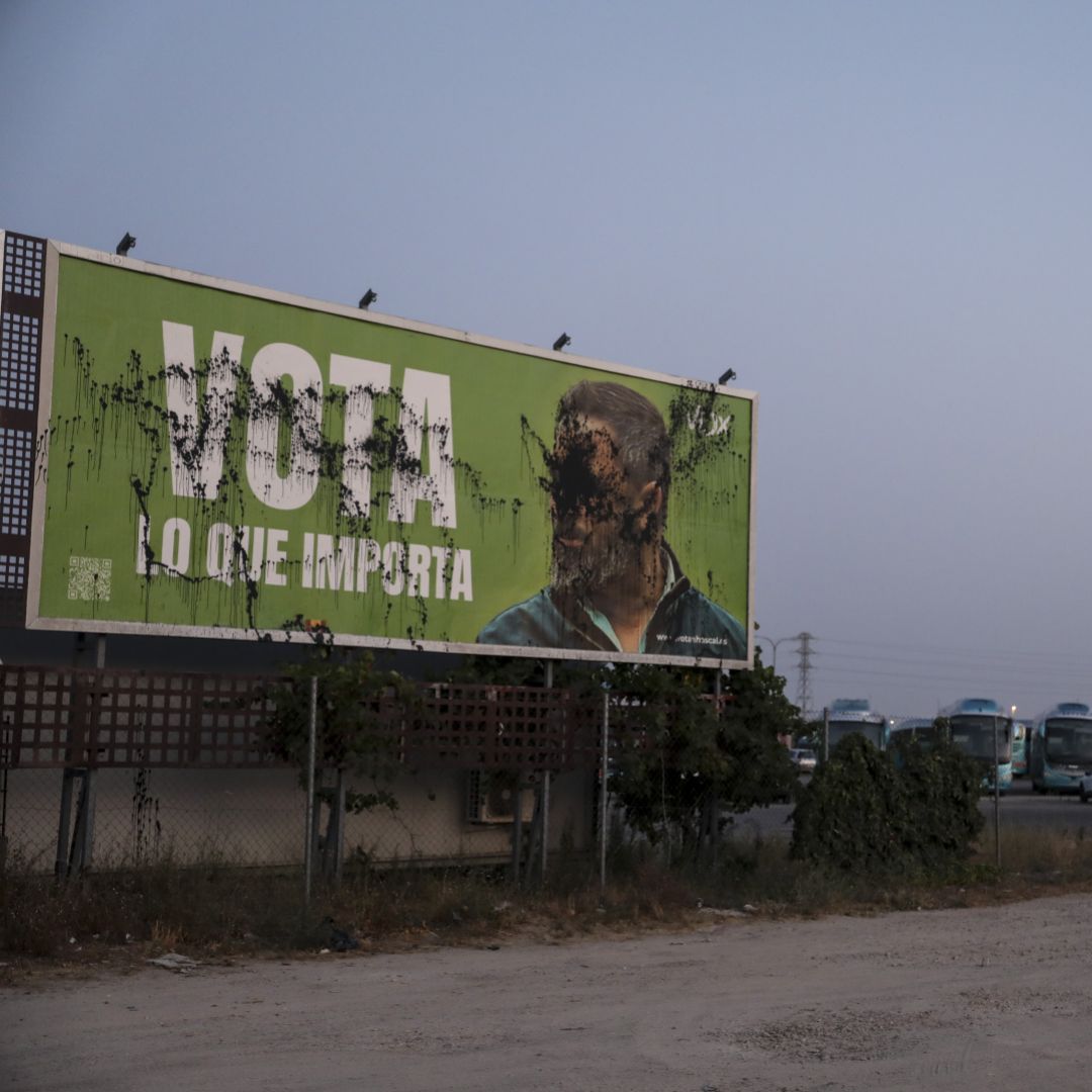 A vandalized billboard promoting Spain's far-right Vox party with an image of its leader is seen near Madrid on July 19, 2023. 